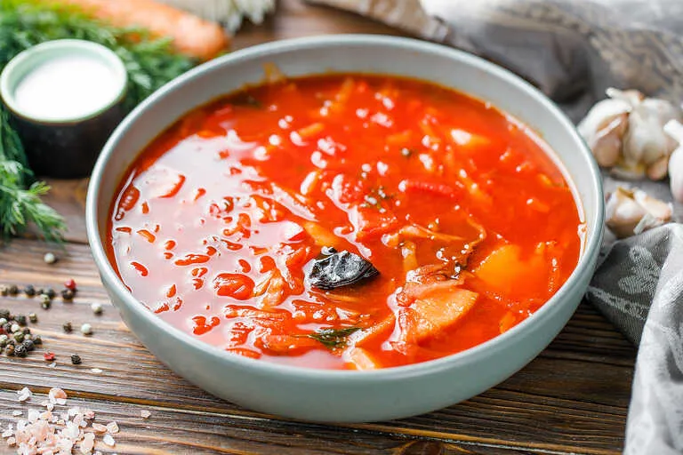 Traditional Ukrainian soup with beets, tomatoes, and pork ribs